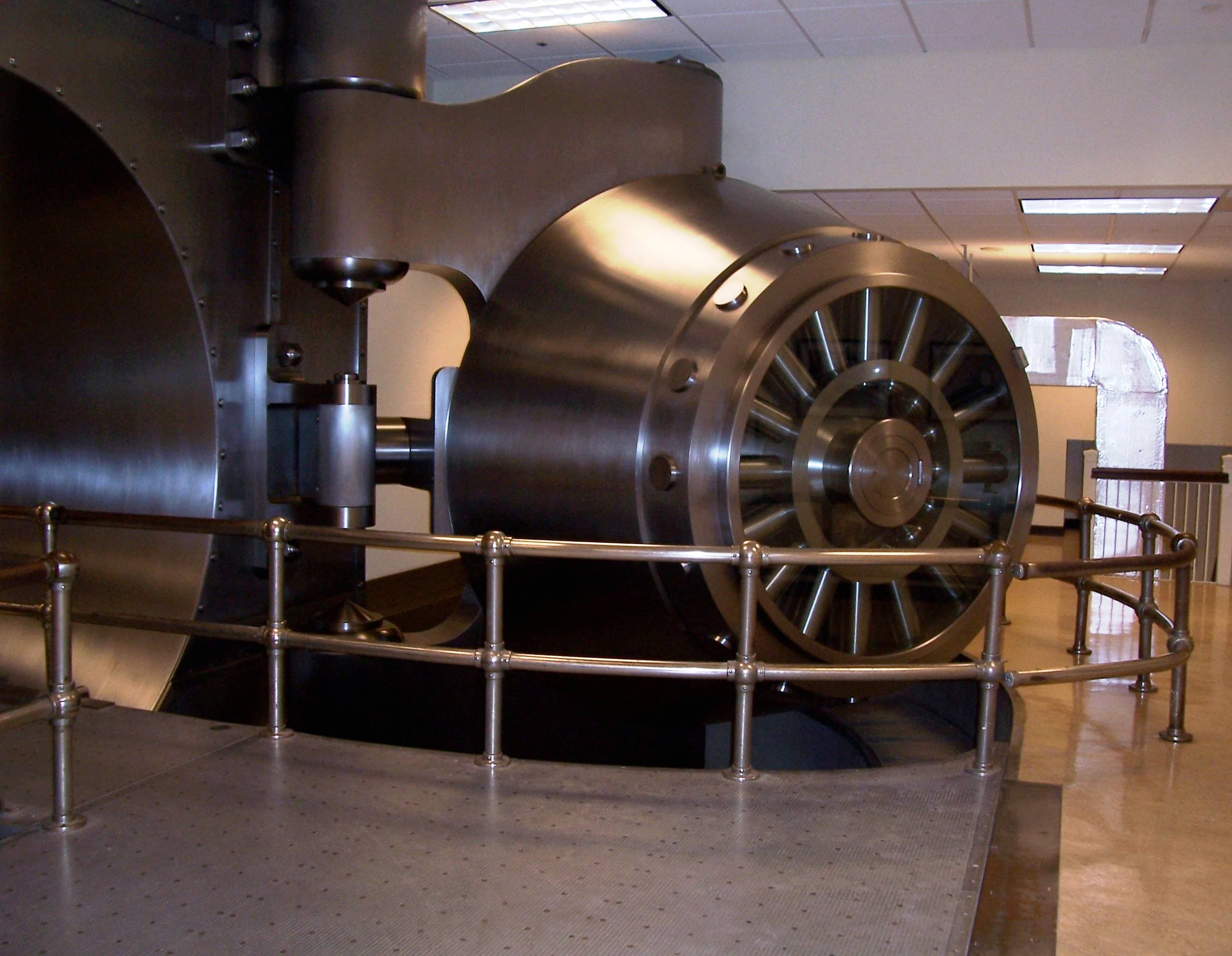 A massive round bank vault door standing open